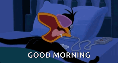 A Cartoon Of A Duck Laying On A Bed With The Words Good Morning Above Him GIF