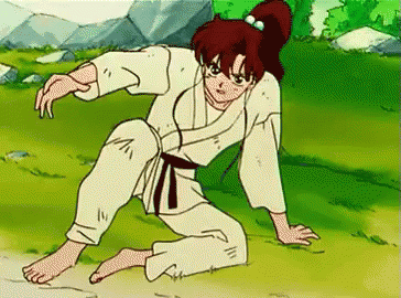 A Cartoon Of A Girl In A Karate Uniform Kneeling On The Ground . GIF