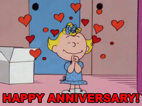 A Cartoon Of A Girl Surrounded By Hearts With The Words Happy Anniversary Written Below Her GIF
