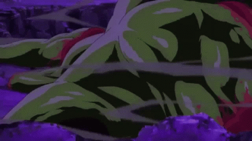 A Cartoon Of A Green Monster Laying On The Ground . GIF