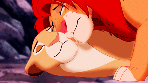 A Cartoon Of A Lion And A Lioness With Their Eyes Closed GIF