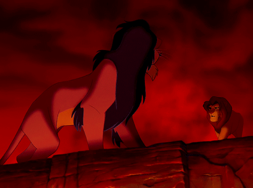 A Cartoon Of A Lion Standing Next To Another Lion With A Red Background GIF