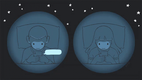 A Cartoon Of A Man And A Woman Looking At Their Cell Phones GIF
