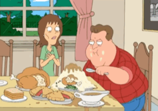 A Cartoon Of A Man And A Woman Sitting At A Table With Food On It GIF