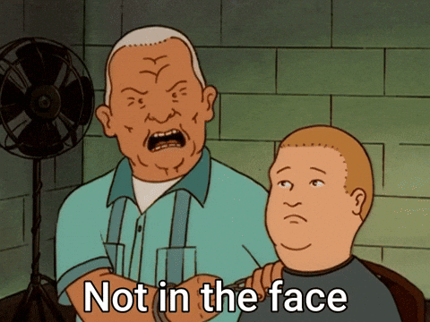 a cartoon of a man getting his hair cut with the words not in the face