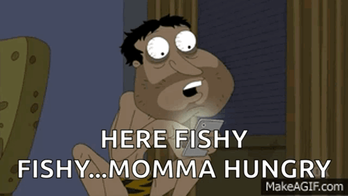 A Cartoon Of A Man Holding A Cell Phone With The Words Here Fishy Fishy Momma Hungry GIF