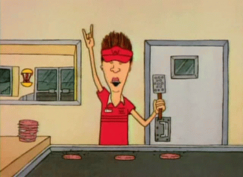 A Cartoon Of A Man Holding A Spatula In A Restaurant GIF
