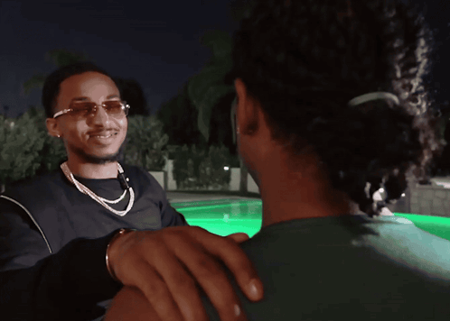 A Cartoon Of A Man Holding Another Man 'S Hand While Another Man Looks On GIF