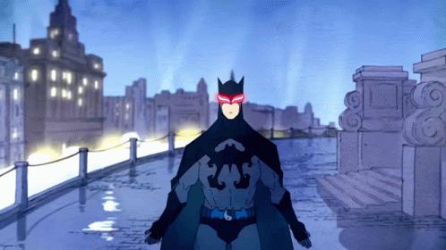 A Cartoon Of A Man In A Batman Costume With Red Eyes GIF