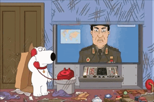 A Cartoon Of A Man In A Military Uniform Talking On A Red Phone GIF