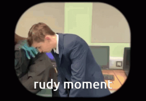 A Cartoon Of A Man In A Suit With The Words Rudy Moment On The Bottom GIF