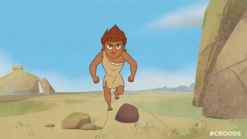 A Cartoon Of A Man Running On A Dirt Road Next To Rocks . GIF