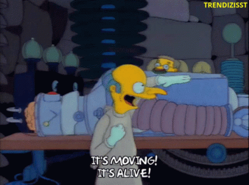 A Cartoon Of A Man Saying It 'S Moving It 'S Alive GIF