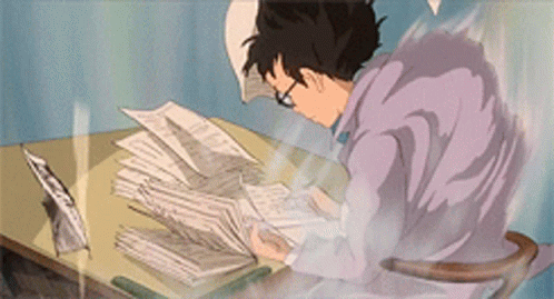 A Cartoon Of A Man Sitting At A Desk With Papers On It GIF