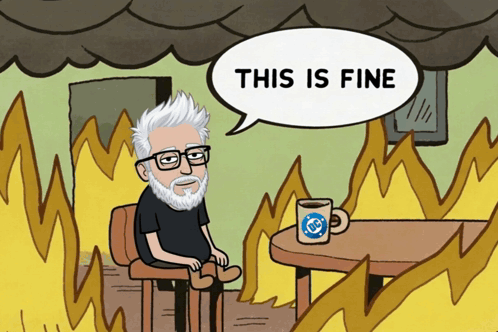 A Cartoon Of A Man Sitting At A Table With A Speech Bubble Saying " This Is Fine " GIF