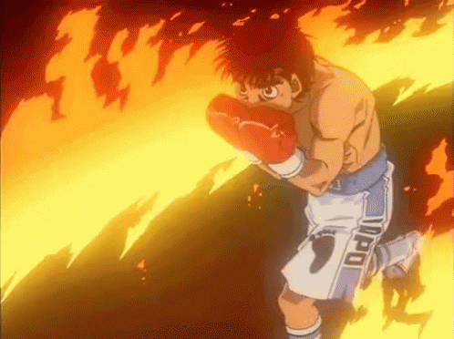 A Cartoon Of A Man Wearing Boxing Gloves And Shorts With The Word Ippo On Them . GIF