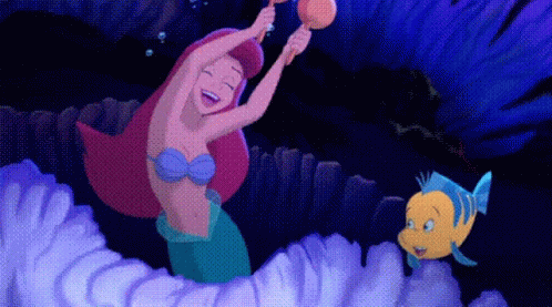 A Cartoon Of A Mermaid And A Fish Playing A Musical Instrument GIF
