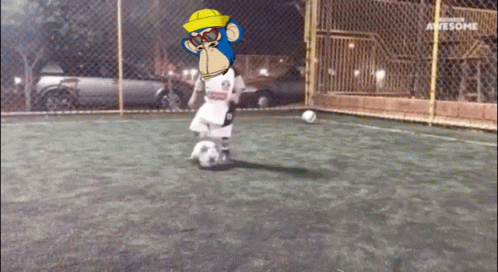 A Cartoon Of A Monkey Kicking A Soccer Ball On A Field That Says Awesome On The Bottom GIF