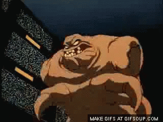 A Cartoon Of A Monster With Horns Standing In Front Of A Television Screen . GIF
