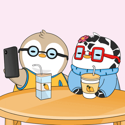 A Cartoon Of A Penguin Taking A Selfie Next To A Cow Wearing Glasses GIF