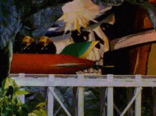 A Cartoon Of A Roller Coaster With A Skull On It GIF