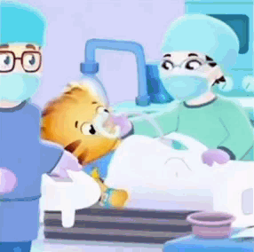 A Cartoon Of A Teddy Bear Being Operated On By A Group Of Doctors GIF