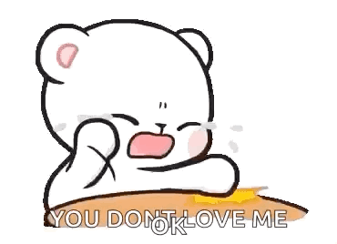 A Cartoon Of A Teddy Bear Crying While Sitting On A Table . GIF