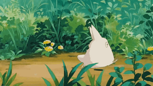 White Rabbit In Green Forest GIF