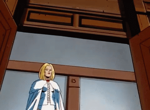 A Cartoon Of A Woman In A Blue And White Cape With The Letter C On Her Chest GIF