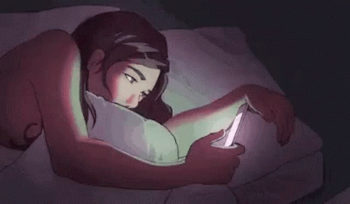 A Cartoon Of A Woman Laying In Bed Looking At Her Phone . GIF