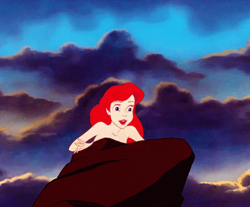 A Cartoon Of A Woman Sitting On A Rock GIF