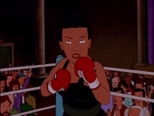 A Cartoon Of A Woman Wearing Boxing Gloves GIF