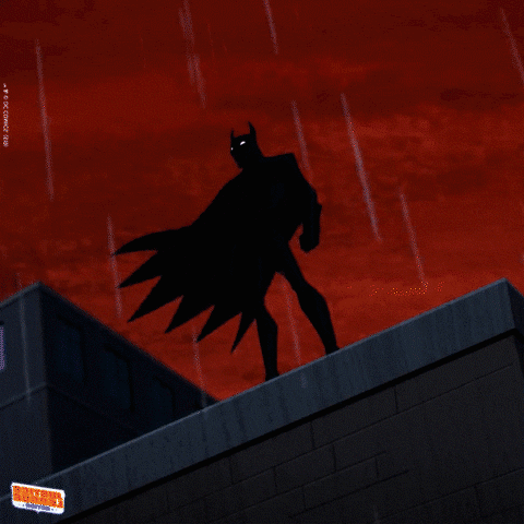 A Cartoon Of Batman Standing On Top Of A Building With A Lightning Bolt Behind Him GIF