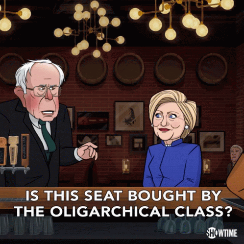 A Cartoon Of Bernie Sanders And Hillary Clinton With The Caption " Is This Seat Bought By The Oligarchical Class " GIF