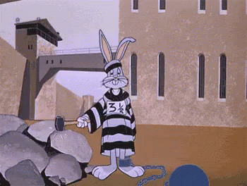 A Cartoon Of Bugs Bunny In A Jail Cell With A Hammer . GIF
