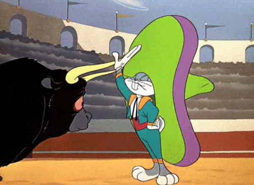 A Cartoon Of Bugs Bunny In A Sombrero Fighting A Bull GIF