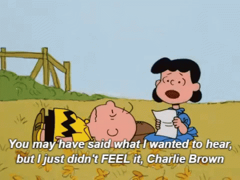 A Cartoon Of Charlie Brown And Lucy Brown Reading A Letter GIF