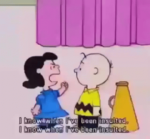 A Cartoon Of Charlie Brown And Lucy Brown Standing Next To Each Other GIF