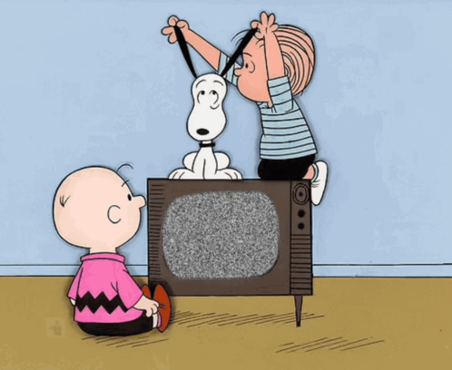 A Cartoon Of Charlie Brown And Snoopy Playing With A Tv GIF