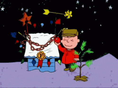 A Cartoon Of Charlie Brown Holding An Apple Next To A Tree GIF