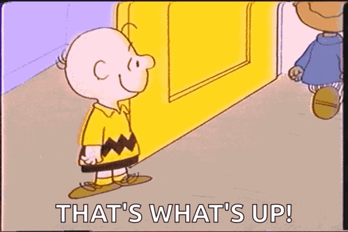 A Cartoon Of Charlie Brown Kissing Another Cartoon Character With The Words That 'S What 'S Up ! GIF