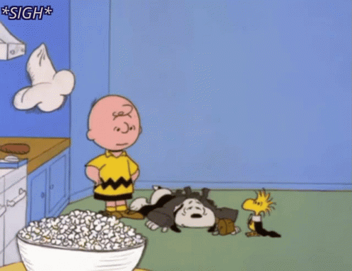 A Cartoon Of Charlie Brown Standing Next To A Bowl Of Popcorn With The Caption Sigh GIF