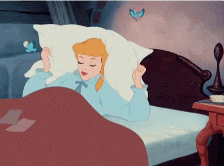 A Cartoon Of Cinderella Laying In Bed With Her Eyes Closed GIF