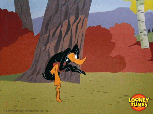 A Cartoon Of Daffy Duck Peeking Out From Behind A Tree With A Looney Tunes Logo In The Corner GIF