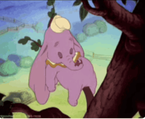 A Cartoon Of Dumbo Hanging On A Tree Branch GIF