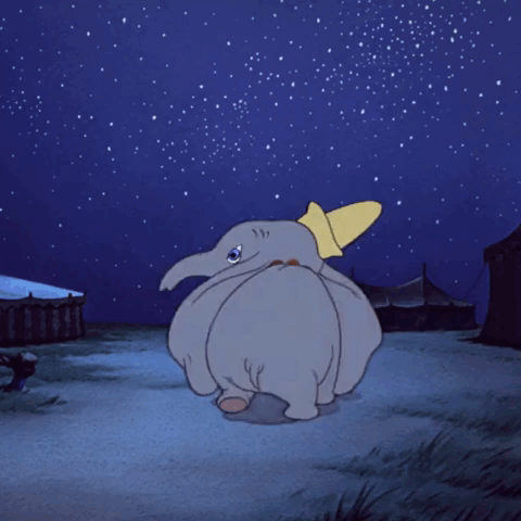 A Cartoon Of Dumbo Looking Up At The Sky GIF