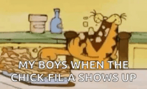 A Cartoon Of Garfield Sitting On A Couch Eating Chicken Nuggets . GIF