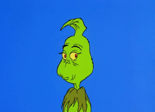 A Cartoon Of Grinch With A Very Angry Look On His Face GIF