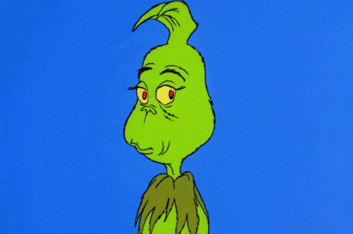 A Cartoon Of Grinch With A Very Angry Look On His Face GIF