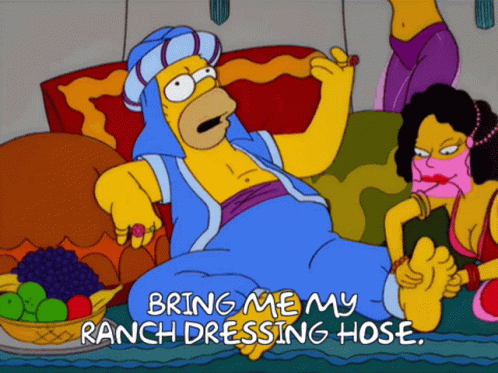 a cartoon of homer simpson laying on a couch with the words bring me my ranch dressing hose on the bottom